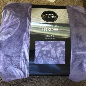 Velvet purple throw with feather design